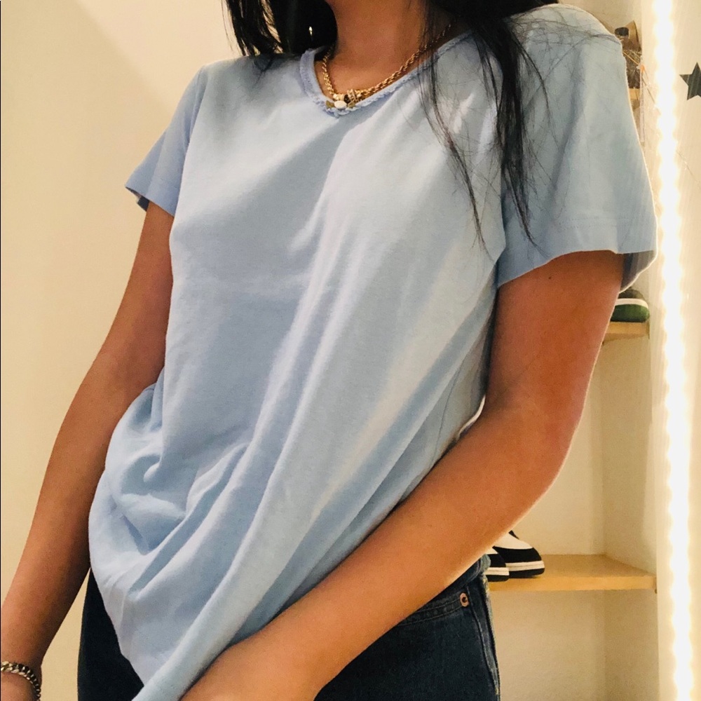 COPY - Baby blue shirt with flower detail.